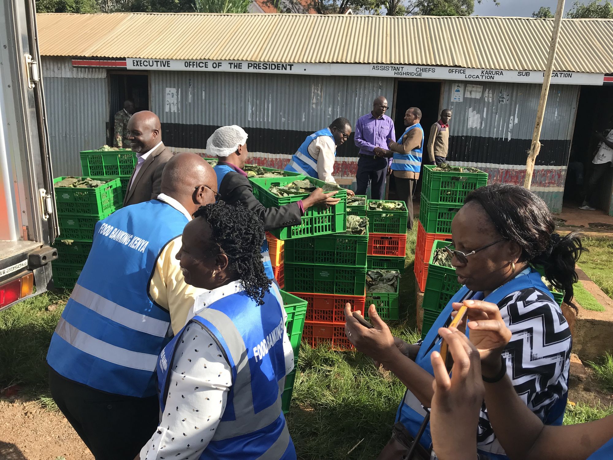 Donated vegetables and staple products are unloaded at a community centre to be redistributed to beneficiaries in the framework of disaster relief activities.
